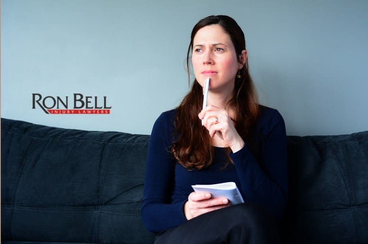 woman-thinking Young woman thinking about to do list at home