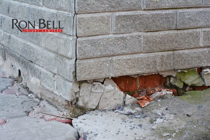 Foundation Repair - Warning Signs. House foundation repair. Foundation Repair. Broken Foundation House Brick Wall.